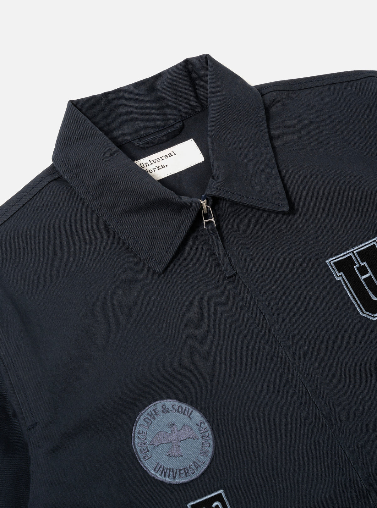 Universal Works Drizzler Jacket in Navy Twill/Badges