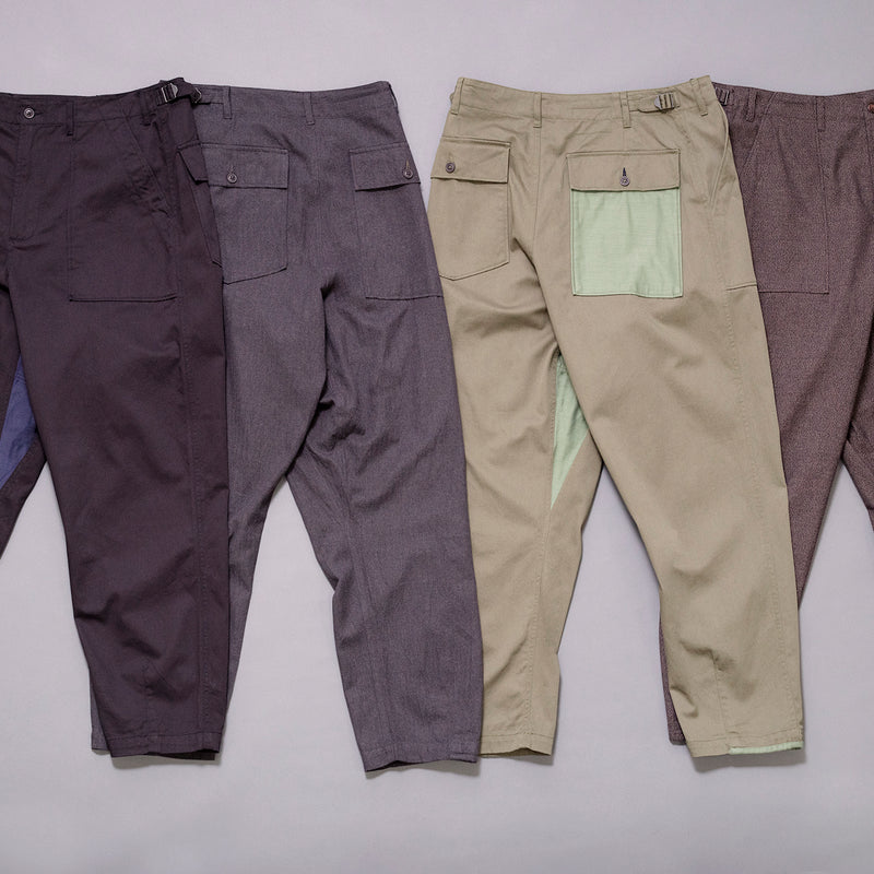 universal works drop crotch fatigue pant in black, charcoal, olive and brown