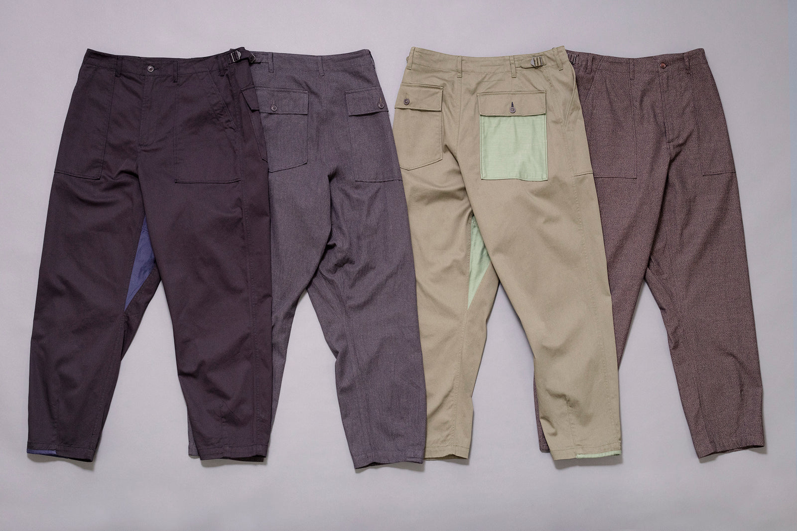 universal works drop crotch fatigue pant in black, charcoal, olive and brown