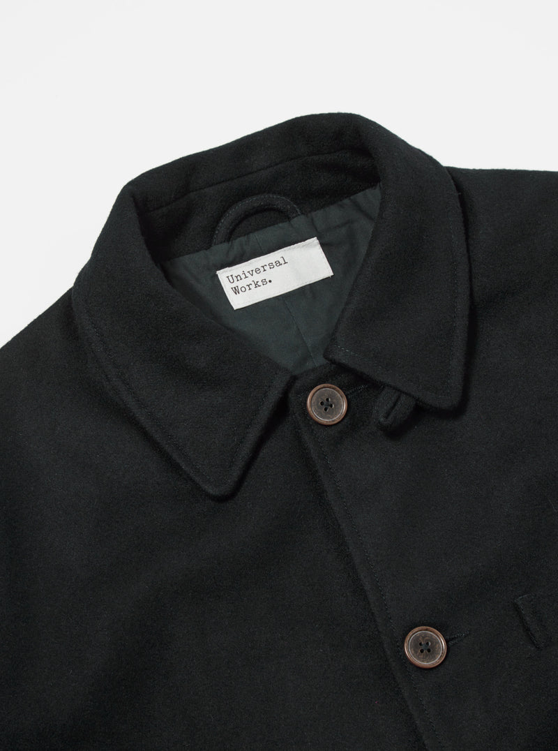 Universal Works Long Swing Overcoat in Black Mowbray