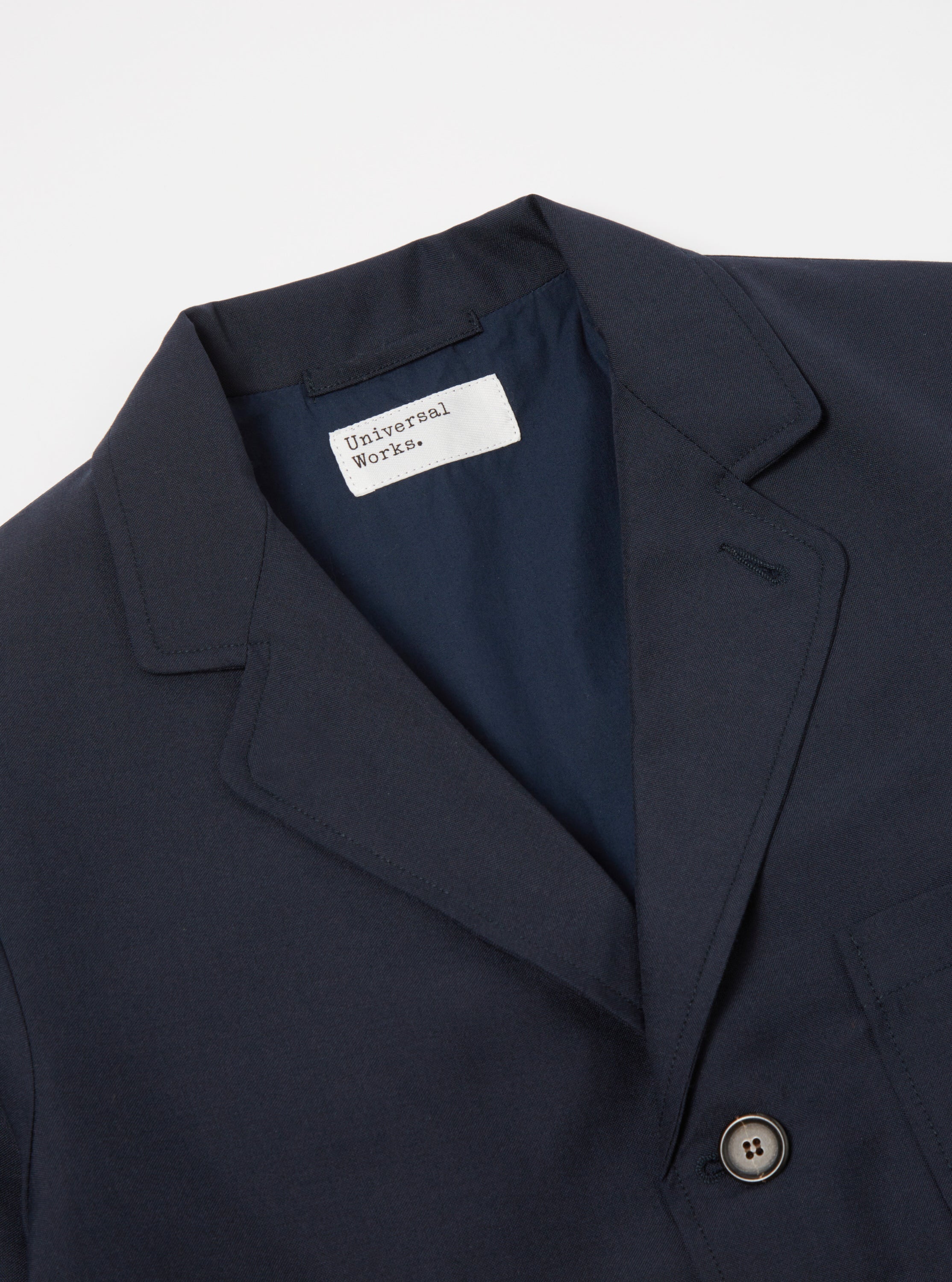 Universal Works Three Button Jacket in Navy Tropical Suiting