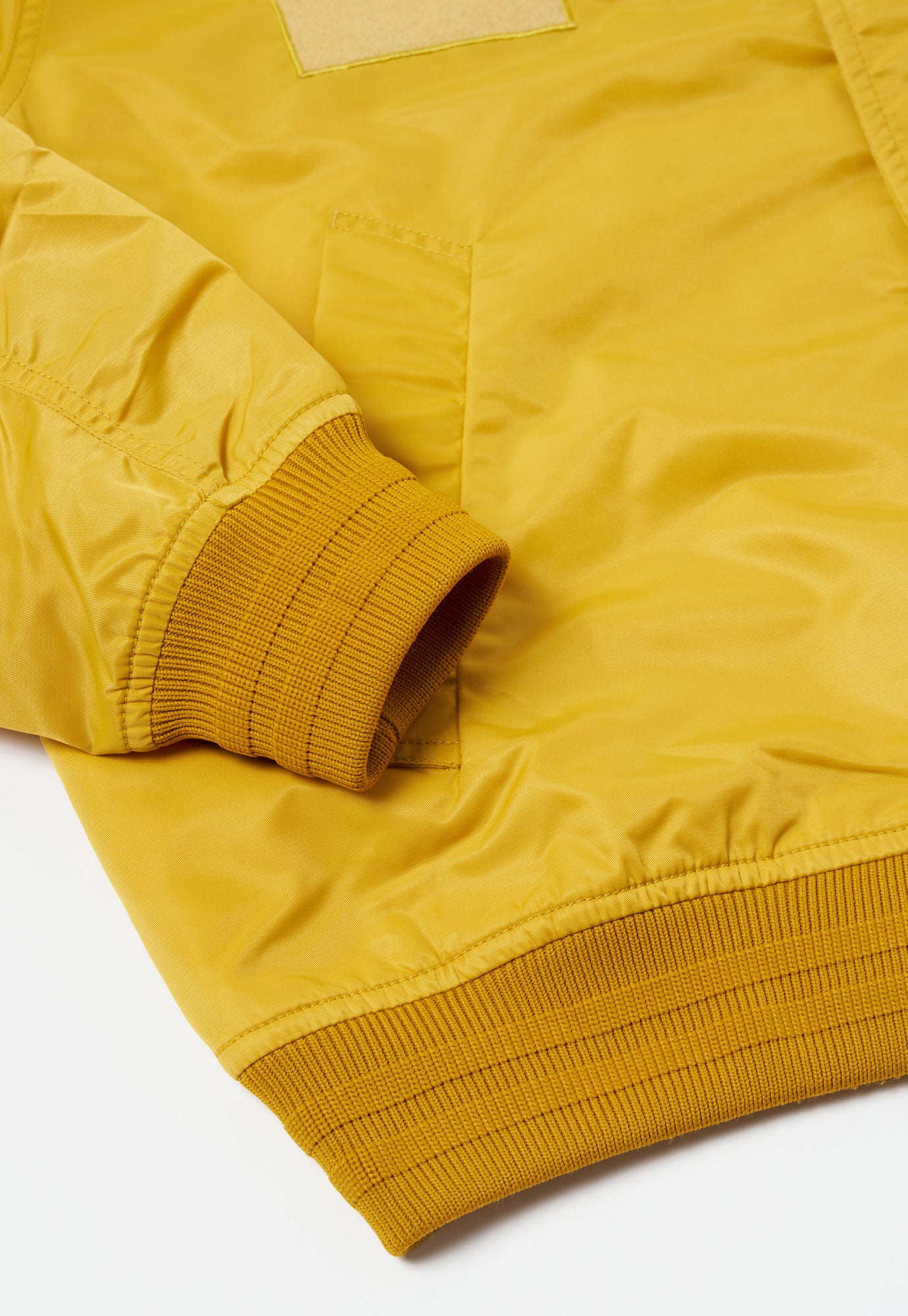 Universal Works Badge Bomber in Yellow Flight Nylon