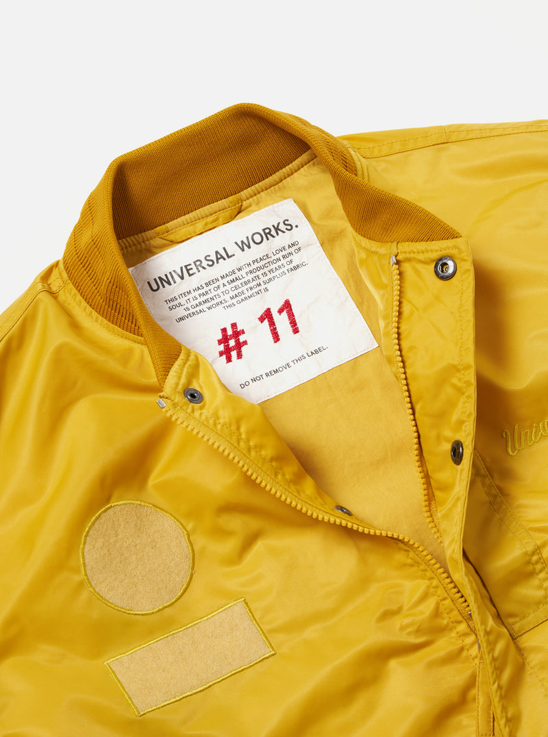 Universal Works Badge Bomber in Yellow Flight Nylon