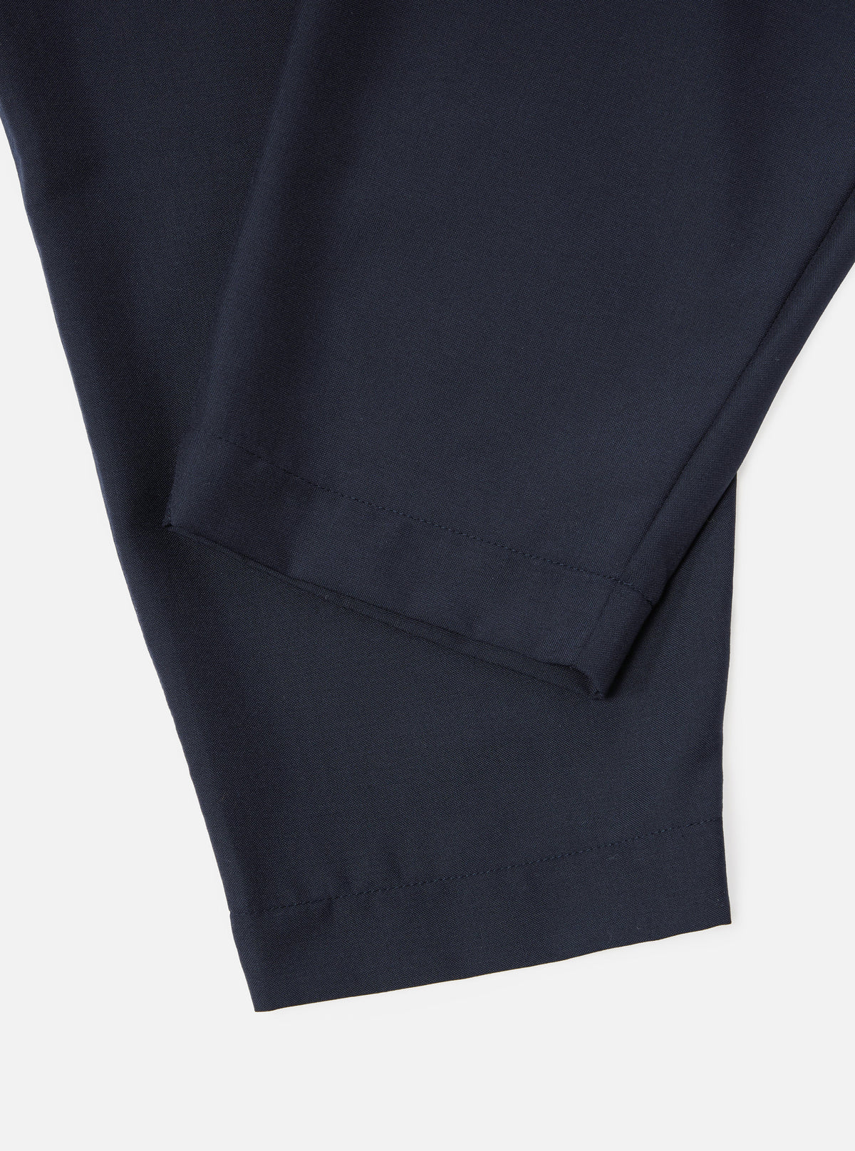 Universal Works Pleated Track Pant in Navy Tropical Suiting