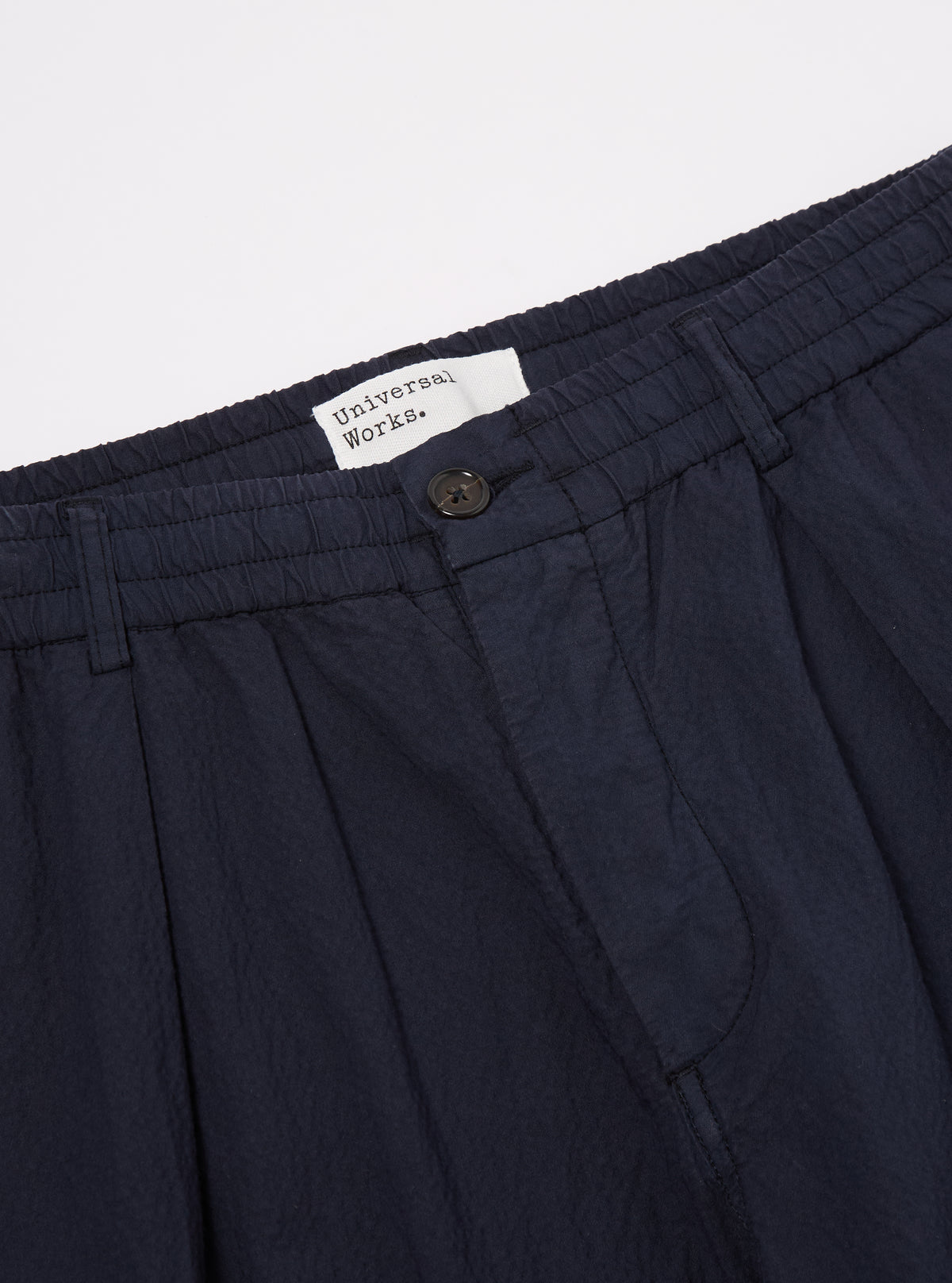 Universal Works Pleated Track Pant in Navy Seersucker II