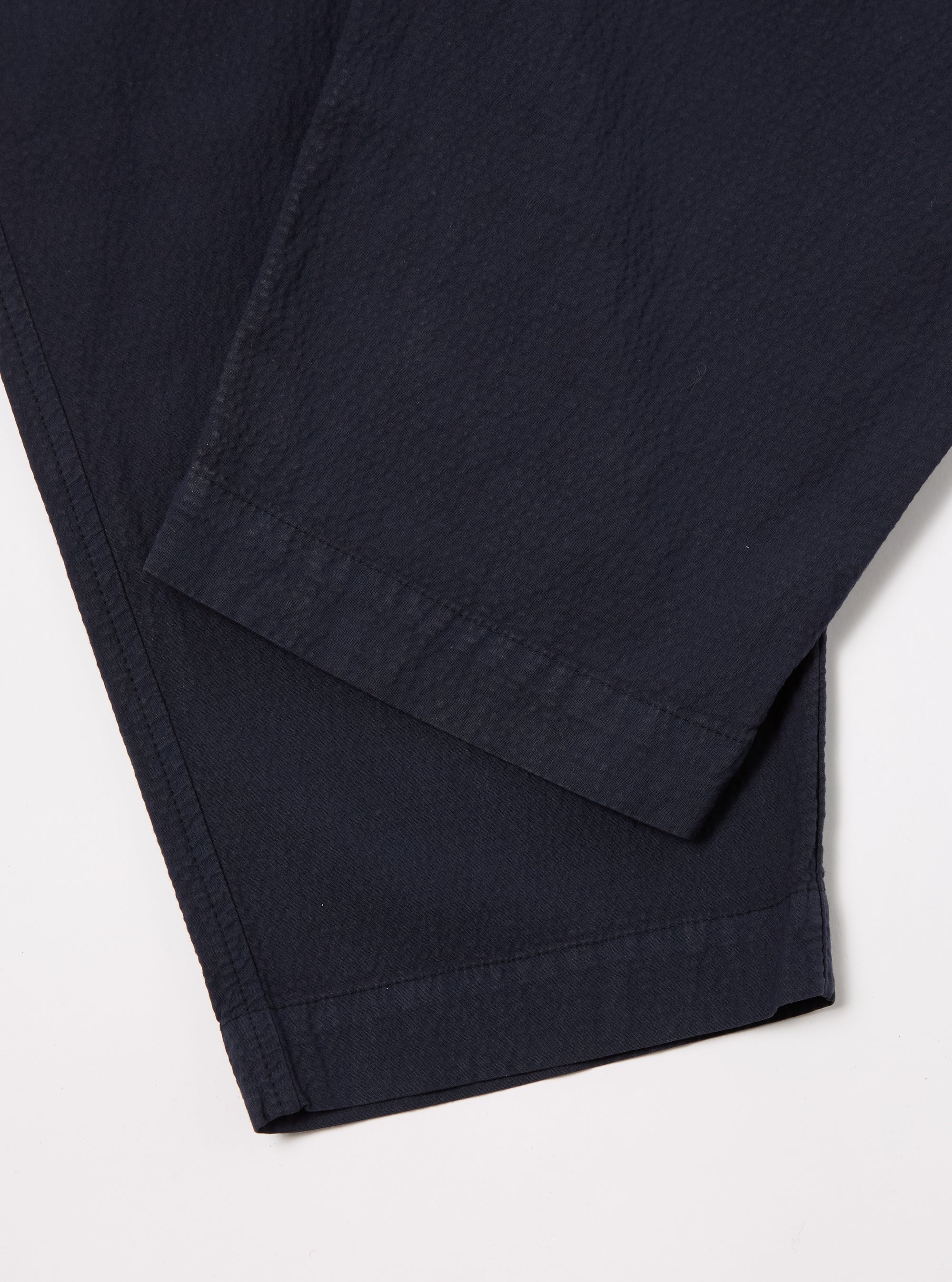 Universal Works Pleated Track Pant in Navy Seersucker II