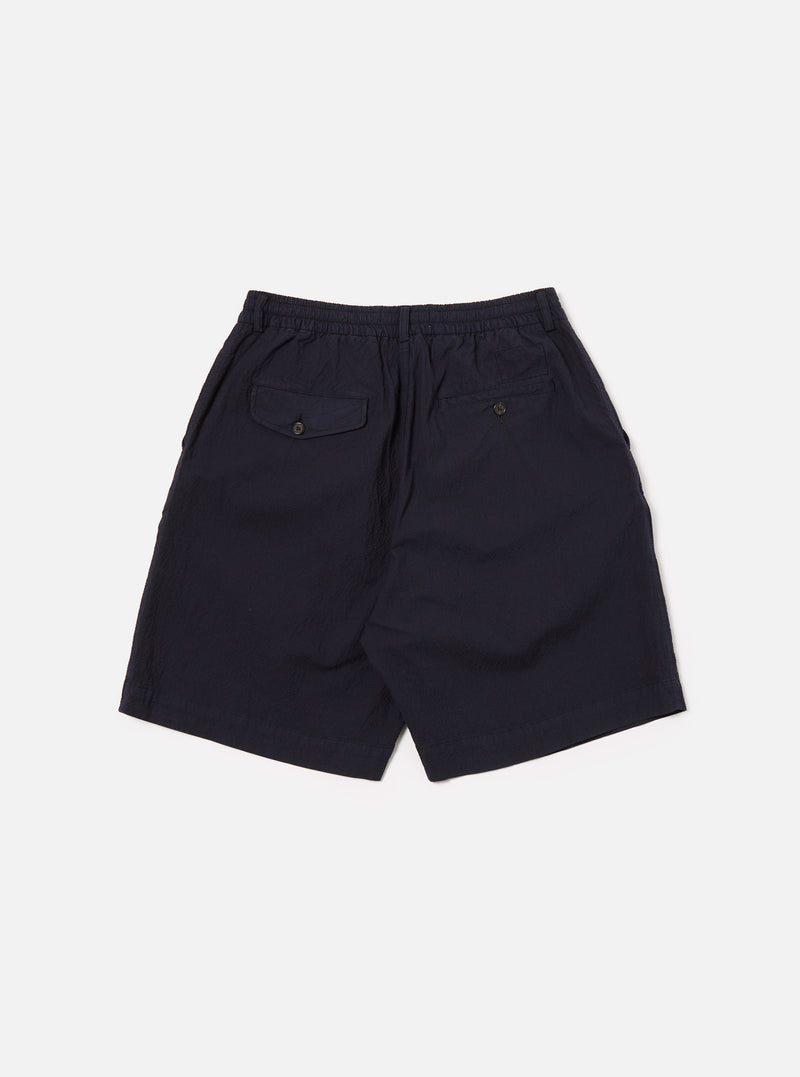 Universal Works Pleated Track Short in Navy Seersucker II