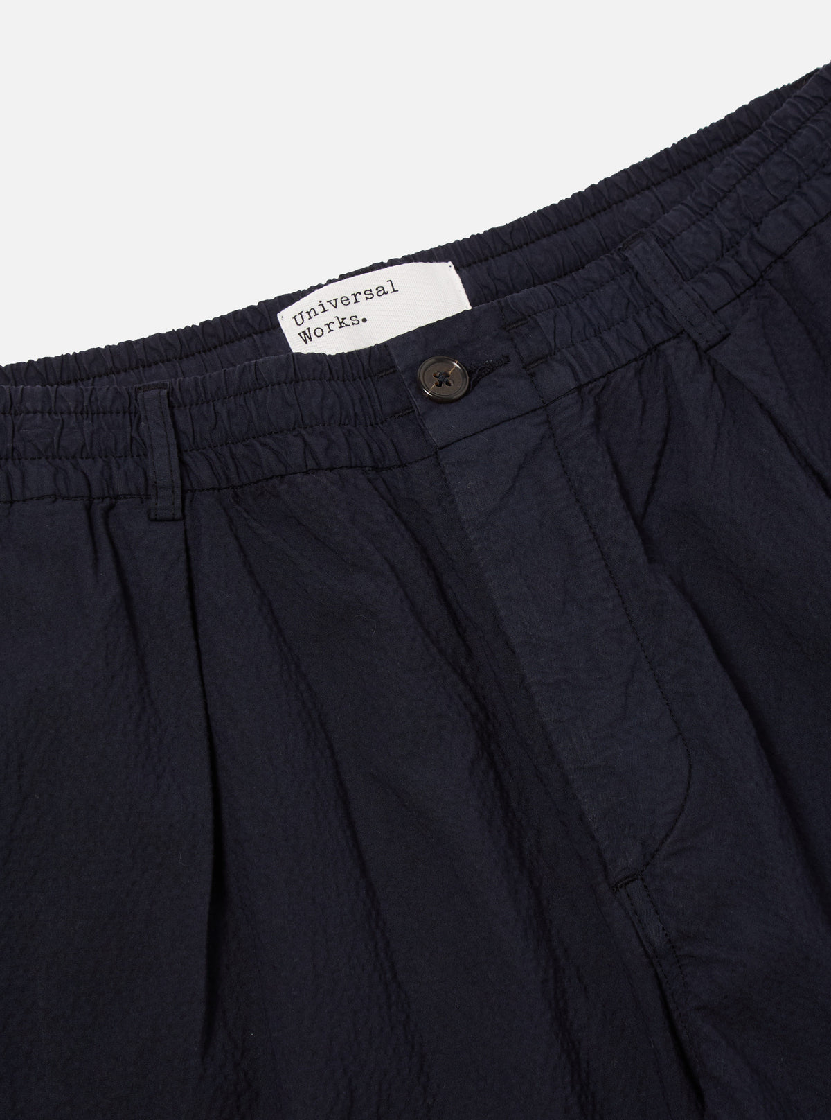 Universal Works Pleated Track Short in Navy Seersucker II