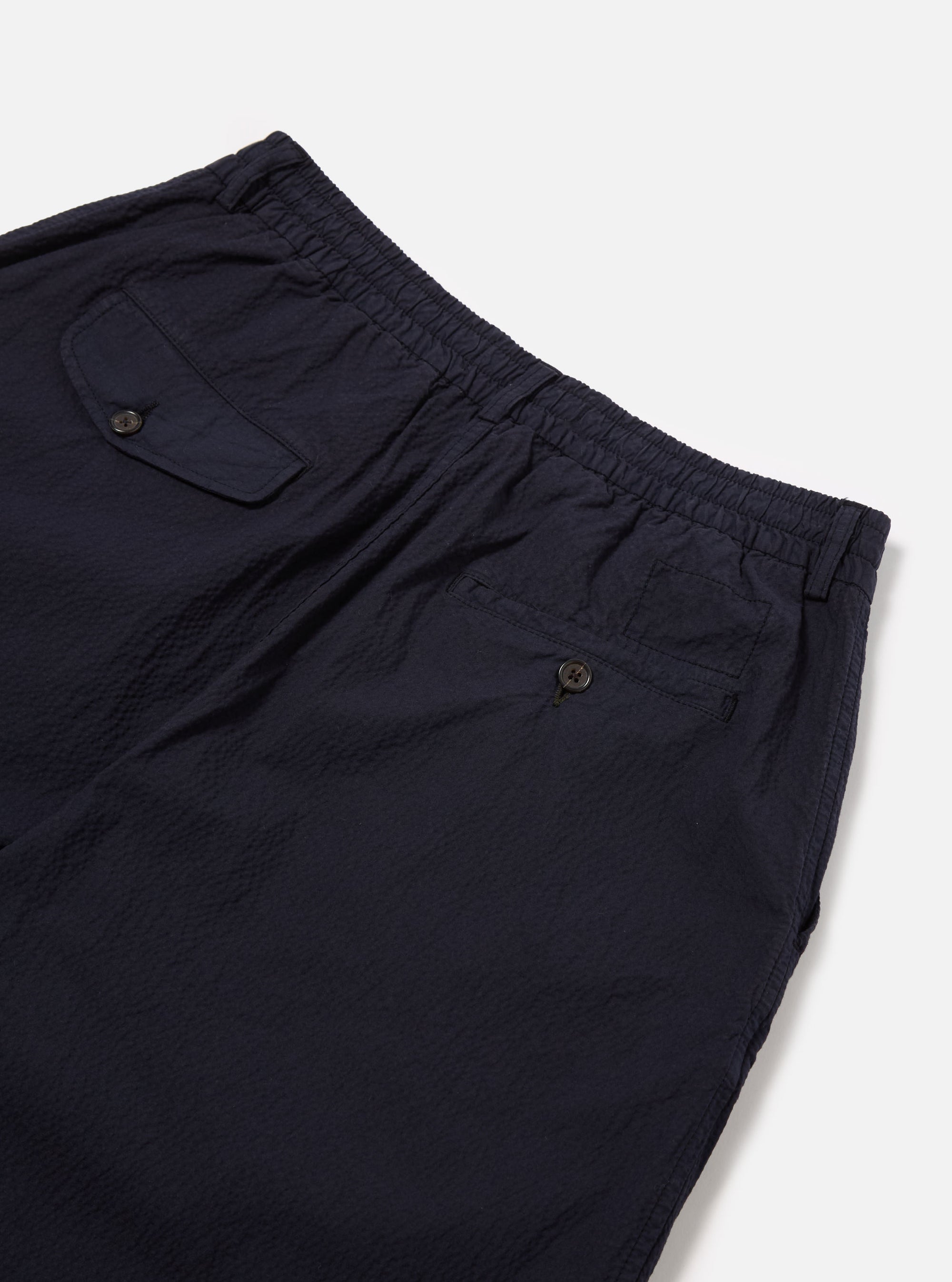 Universal Works Pleated Track Short in Navy Seersucker II