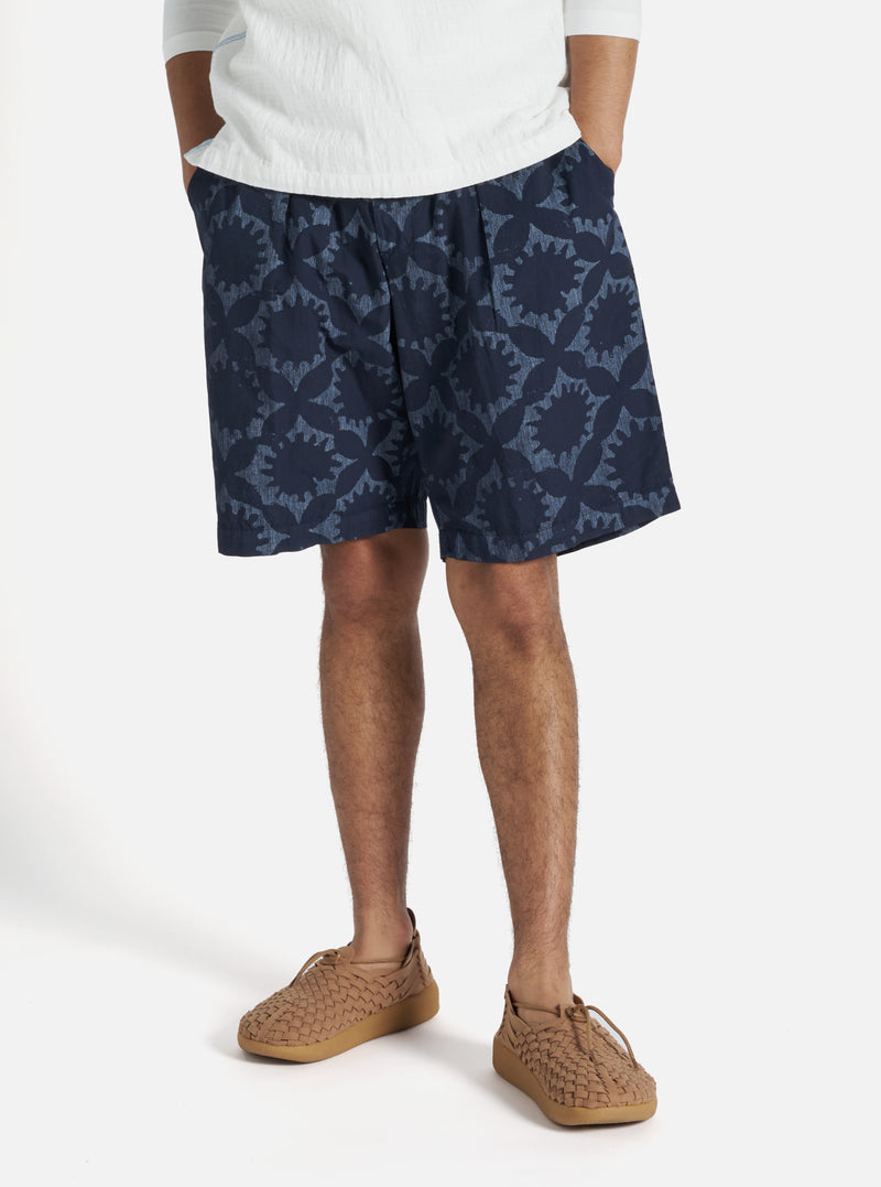 Universal Works Pleated Track Short in Navy Over Dyed Sun Print