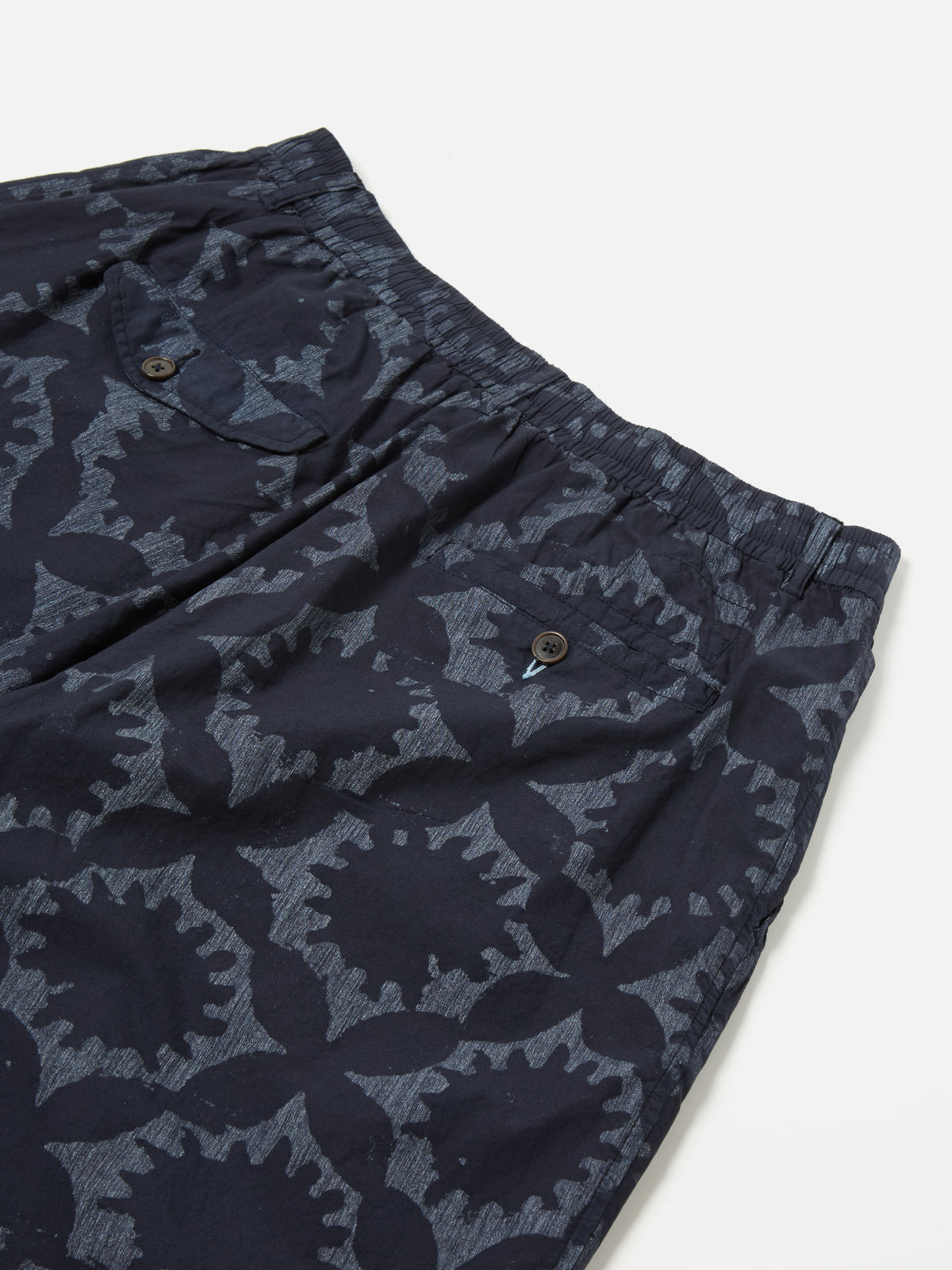 Universal Works Pleated Track Short in Navy Over Dyed Sun Print