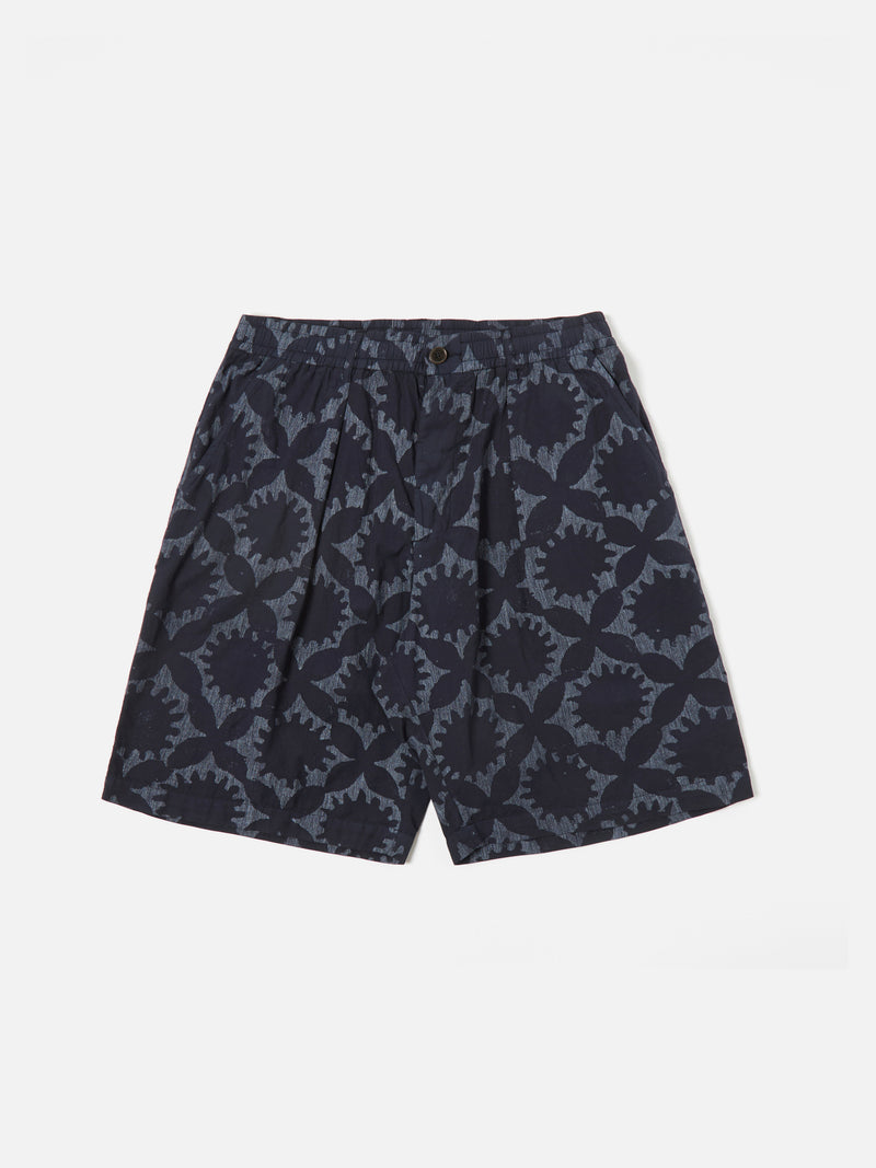Universal Works Pleated Track Short in Navy Over Dyed Sun Print