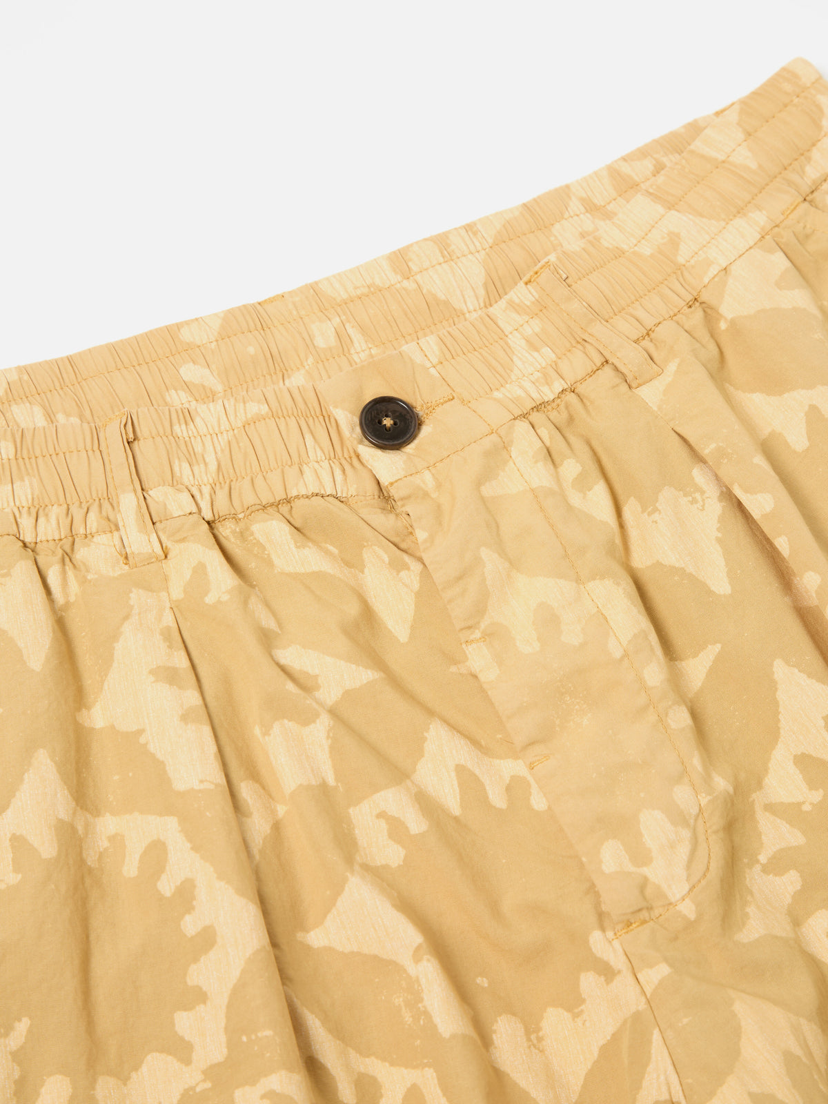 Universal Works Pleated Track Short in Sand Over Dyed Sun Print