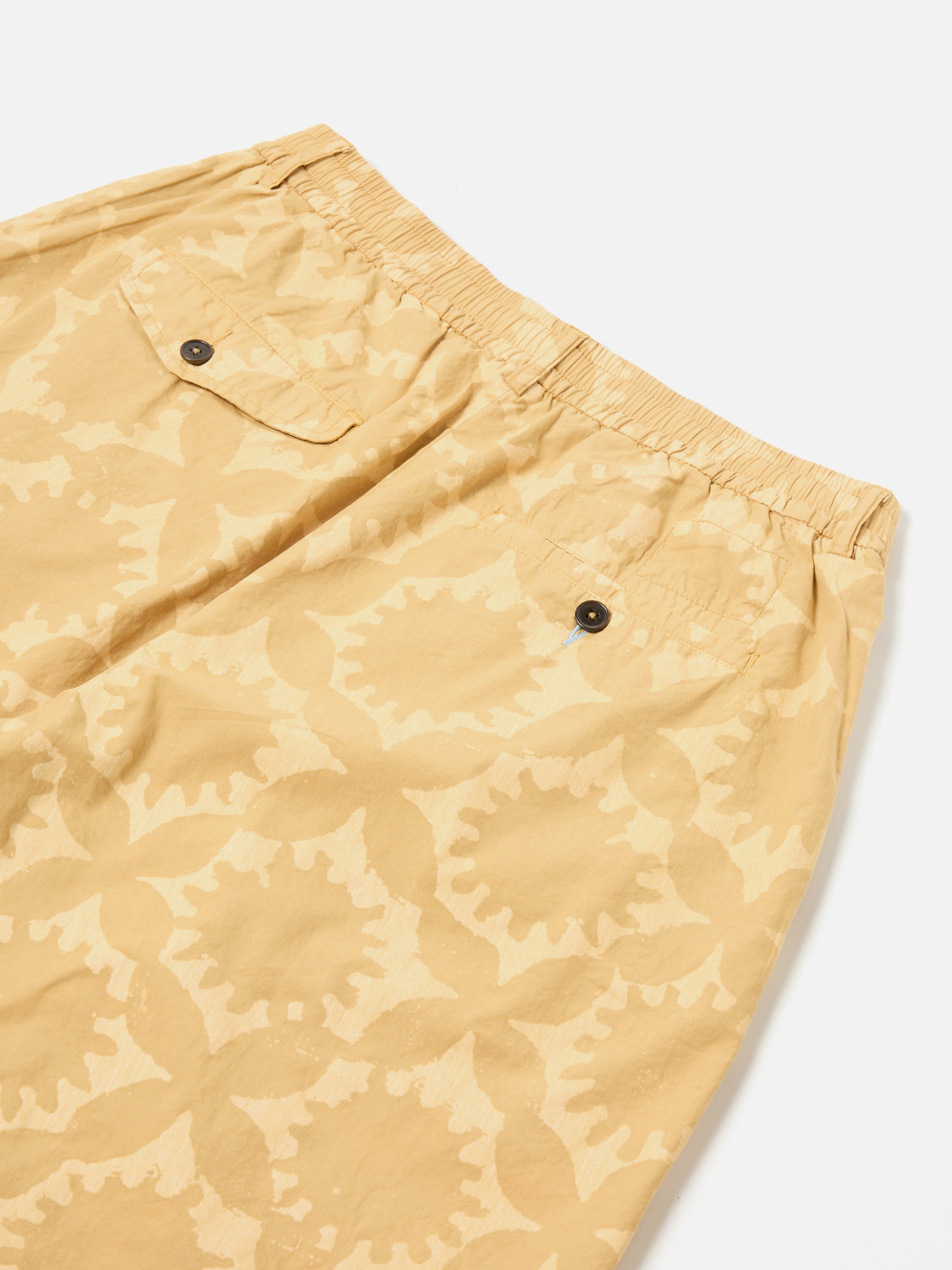 Universal Works Pleated Track Short in Sand Over Dyed Sun Print