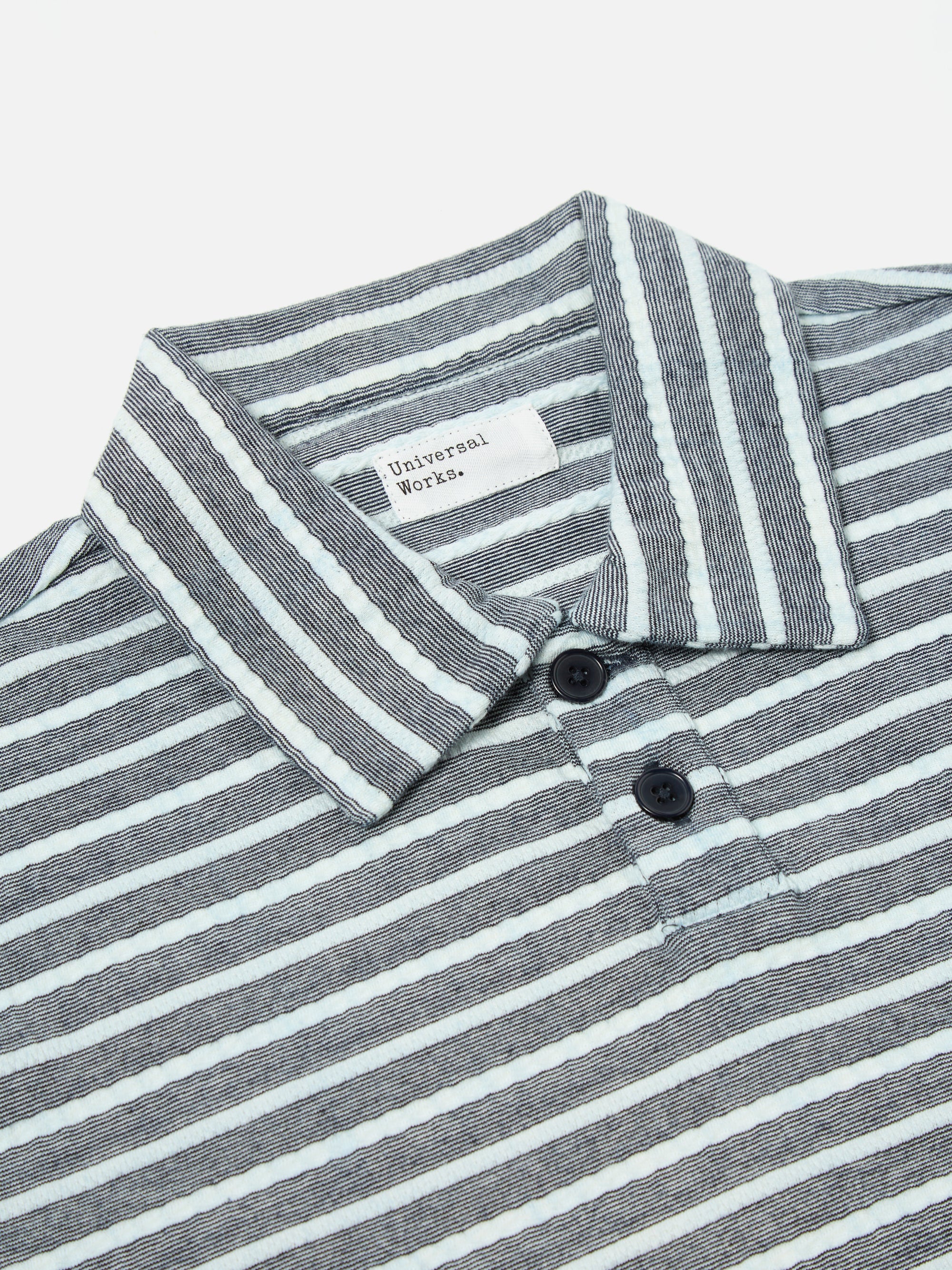 Universal Works Newlyn Polo in Indigo Textured Knit Stripe