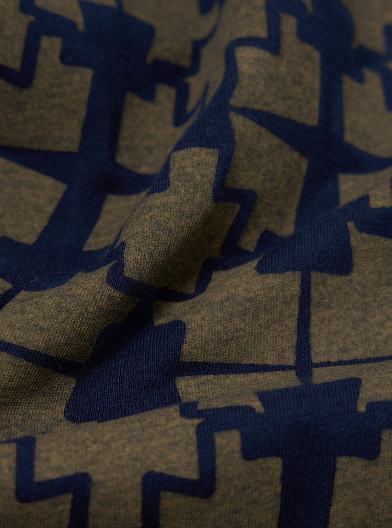 Universal Works Newlyn Polo Tee in Navy/Mud Mitla Print Jersey